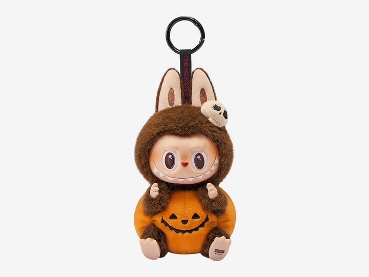 Add a touch of spooky charm to your collection with the Pop Mart Labubu Sitting Pumpkin Vinyl Plush Pendant. This adorable pendant features Labubu sitting snugly inside a cute pumpkin, combining Pop Mart’s signature playful design with Halloween vibes you can enjoy year-round.