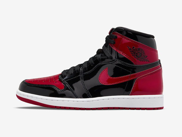 Timeless Air Jordan 1 High sneakers in a classic red and black colour scheme.