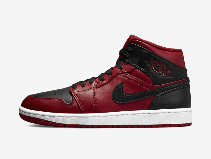 Classic Jordan 1 Mid shoes with a red and black colourway.