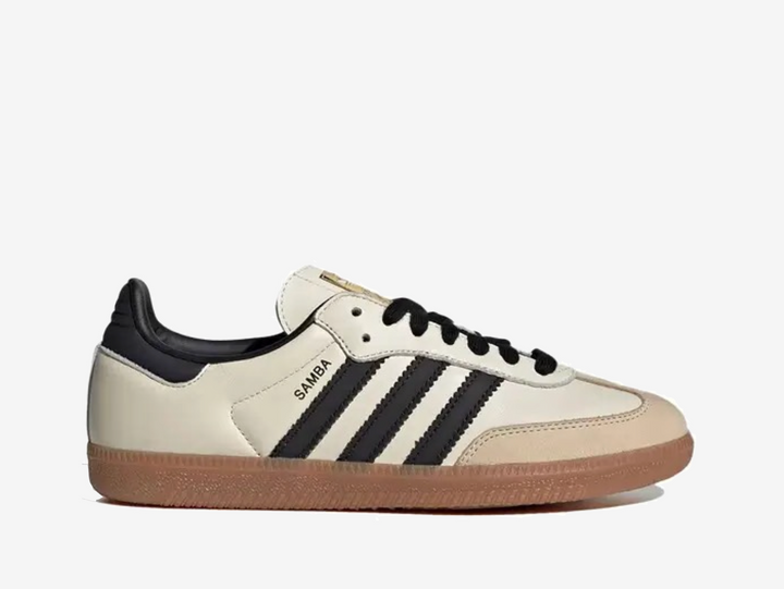 Exclusive Adidas Samba trainers in a cream and black colour scheme.