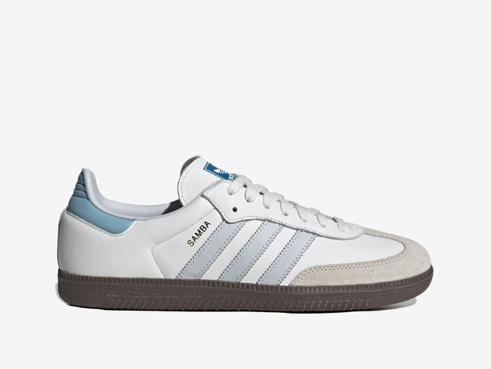 Classic Adidas sneakers in a white and blue colourway.