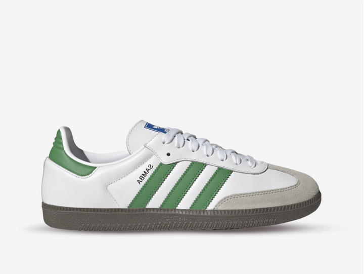 Classic Adidas sneakers in a white and green colourway.
