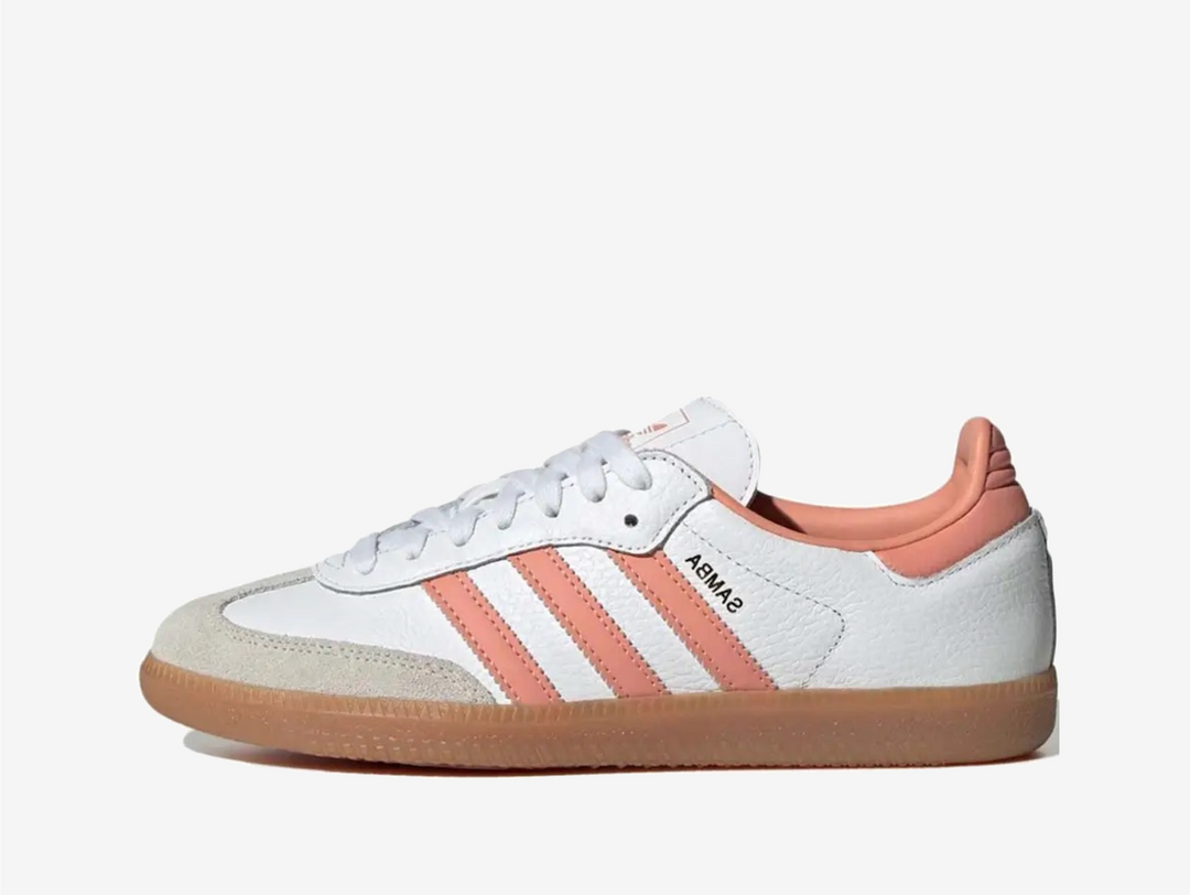 Classic Adidas sneakers in a white and pink colourway.