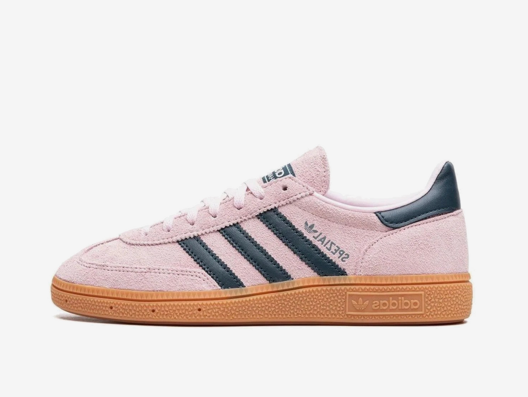 Exclusive Adidas sneakers in a pink and navy colourway.