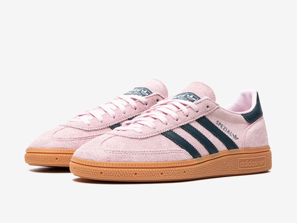 Exclusive Adidas sneakers in a pink and navy colourway.