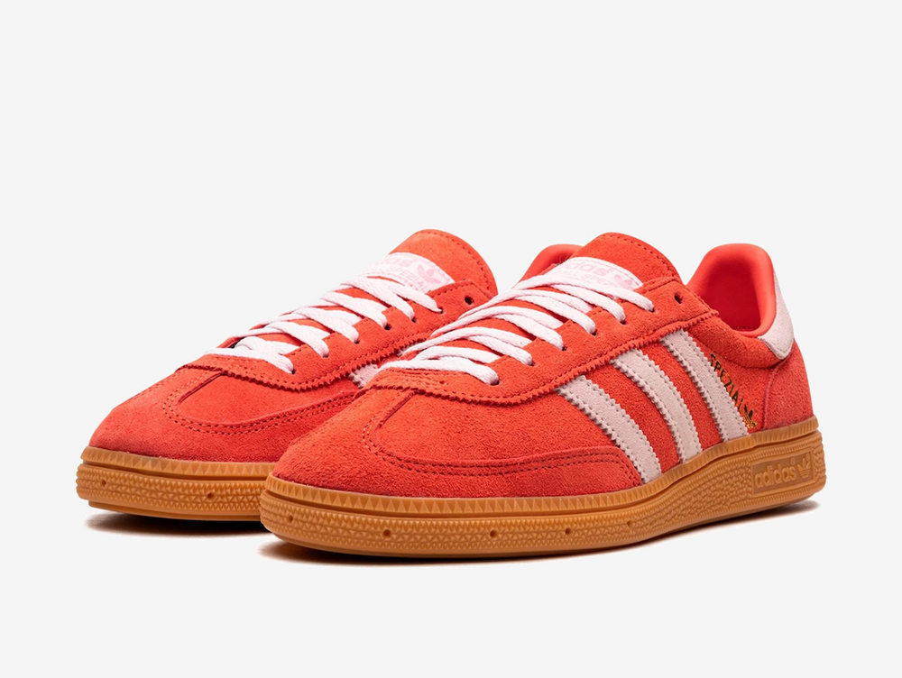Exclusive Adidas sneakers in a red and pink colourway.