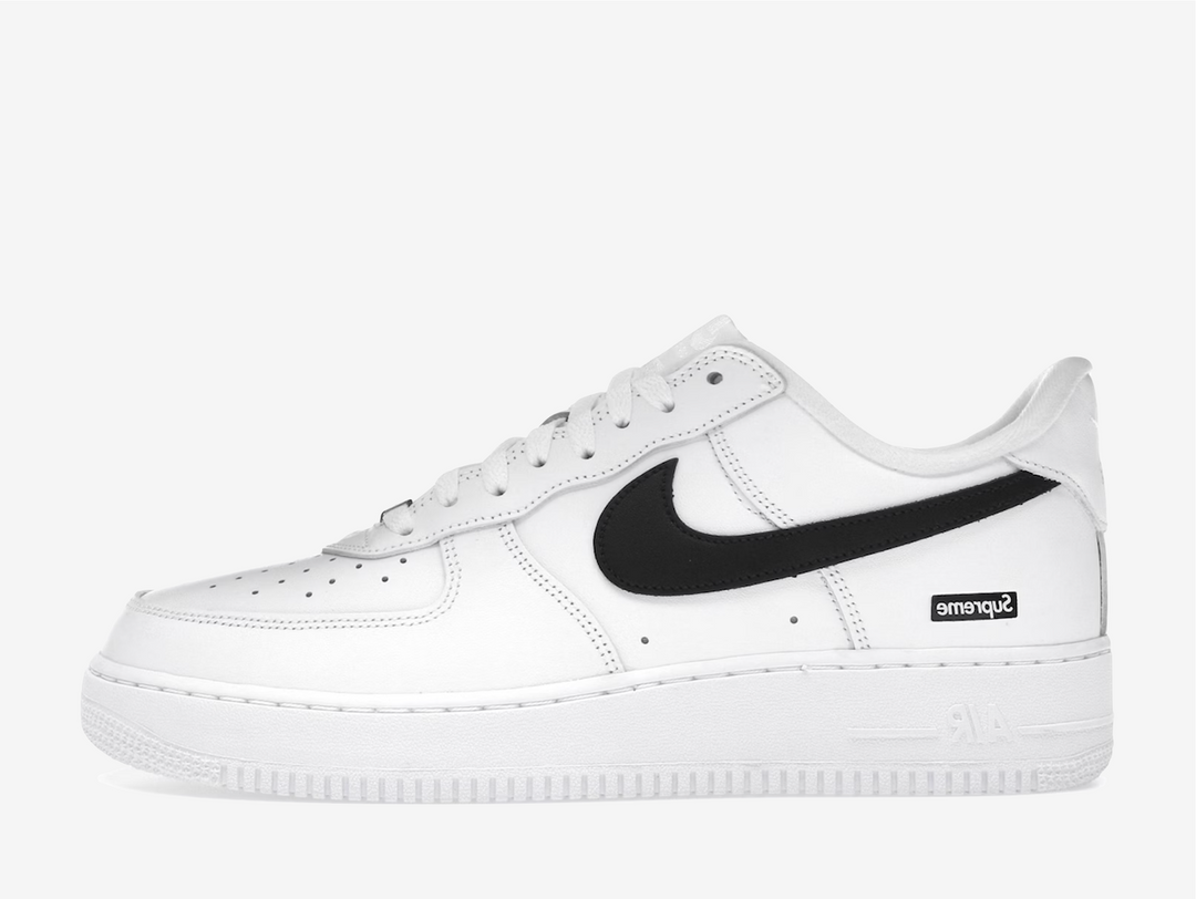 Crafted from premium white leather with a contrasting black Swoosh, this edition balances timeless design with streetwear edge. Co-branded details on the tongue, insole, and lace lock subtly elevate the look, while the classic Air sole unit ensures lasting comfort. Clean, versatile, and instantly recognizable, this FW25 release captures the essence of both brands — a perfect blend of heritage basketball DNA and Supreme’s unmistakable downtown attitude.