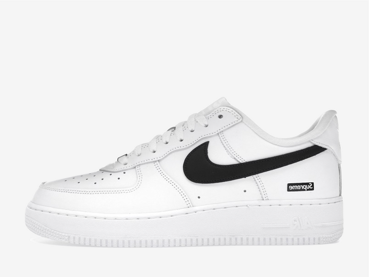 Crafted from premium white leather with a contrasting black Swoosh, this edition balances timeless design with streetwear edge. Co-branded details on the tongue, insole, and lace lock subtly elevate the look, while the classic Air sole unit ensures lasting comfort. Clean, versatile, and instantly recognizable, this FW25 release captures the essence of both brands — a perfect blend of heritage basketball DNA and Supreme’s unmistakable downtown attitude.