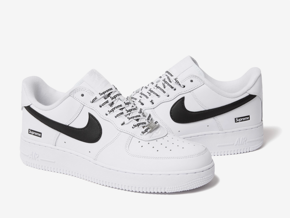 Crafted from premium white leather with a contrasting black Swoosh, this edition balances timeless design with streetwear edge. Co-branded details on the tongue, insole, and lace lock subtly elevate the look, while the classic Air sole unit ensures lasting comfort. Clean, versatile, and instantly recognizable, this FW25 release captures the essence of both brands — a perfect blend of heritage basketball DNA and Supreme’s unmistakable downtown attitude.
