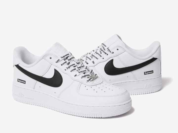 Crafted from premium white leather with a contrasting black Swoosh, this edition balances timeless design with streetwear edge. Co-branded details on the tongue, insole, and lace lock subtly elevate the look, while the classic Air sole unit ensures lasting comfort. Clean, versatile, and instantly recognizable, this FW25 release captures the essence of both brands — a perfect blend of heritage basketball DNA and Supreme’s unmistakable downtown attitude.