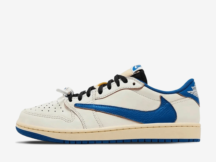 The Air Jordan 1 Low Travis Scott Fragment Sail Military Blue combines Travis Scott’s signature reverse Swoosh with Fragment Design detailing across a clean Sail, white and blue colour palette. Premium leather construction, contrast branding and co-branded details give the low-top silhouette a distinctive collaborative finish. Finished with classic Air Jordan cushioning and a durable rubber outsole, the pair blends everyday comfort with one of the most recognisable designs partnership.
