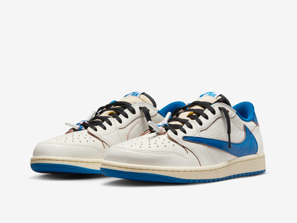 The Air Jordan 1 Low Travis Scott Fragment Sail Military Blue combines Travis Scott’s signature reverse Swoosh with Fragment Design detailing across a clean Sail, white and blue colour palette. Premium leather construction, contrast branding and co-branded details give the low-top silhouette a distinctive collaborative finish. Finished with classic Air Jordan cushioning and a durable rubber outsole, the pair blends everyday comfort with one of the most recognisable designs partnership.