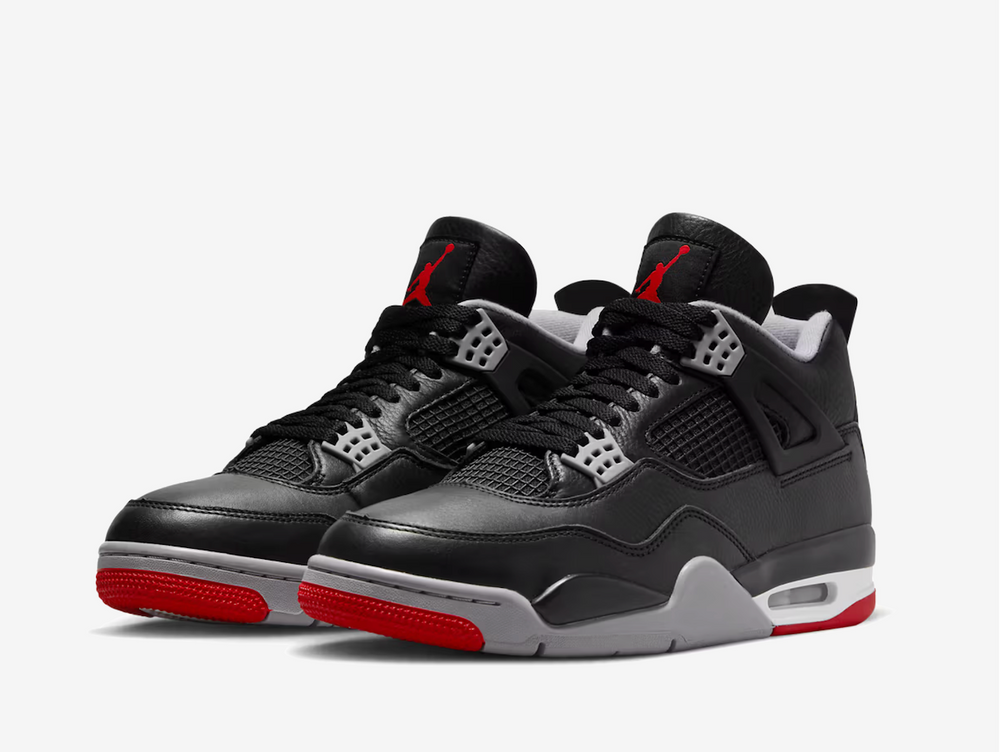 Exclusive Air Jordan 4 sneakers with a black leather upper, featuring grey white and red details.