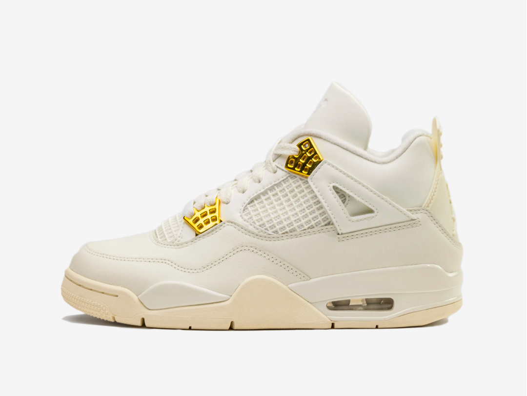 Exclusive Air Jordan 4 Sneakers in a cream and gold colourway.