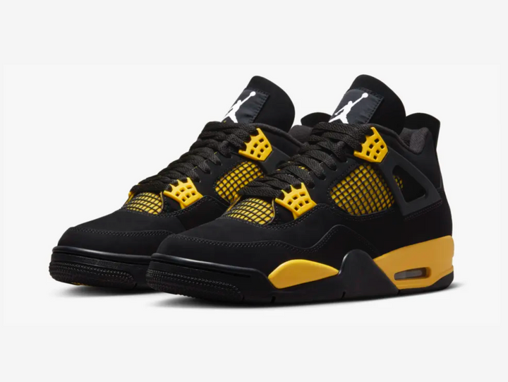 Classic Jordan 4 shoes with a yellow and black colourway.