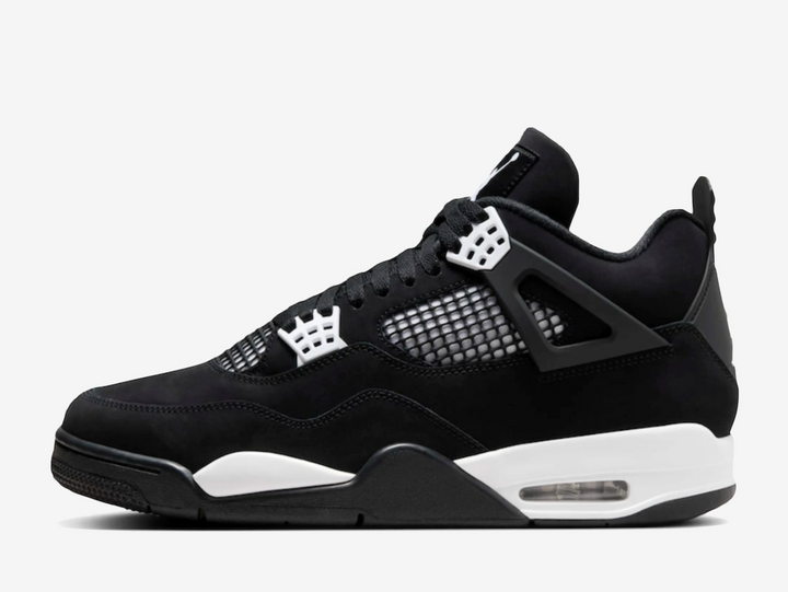 Exclusive Air Jordan 4 sneakers in a black and white colour scheme, featuring a black nubuck upper with white plastic netting on the sides and forefoot. 