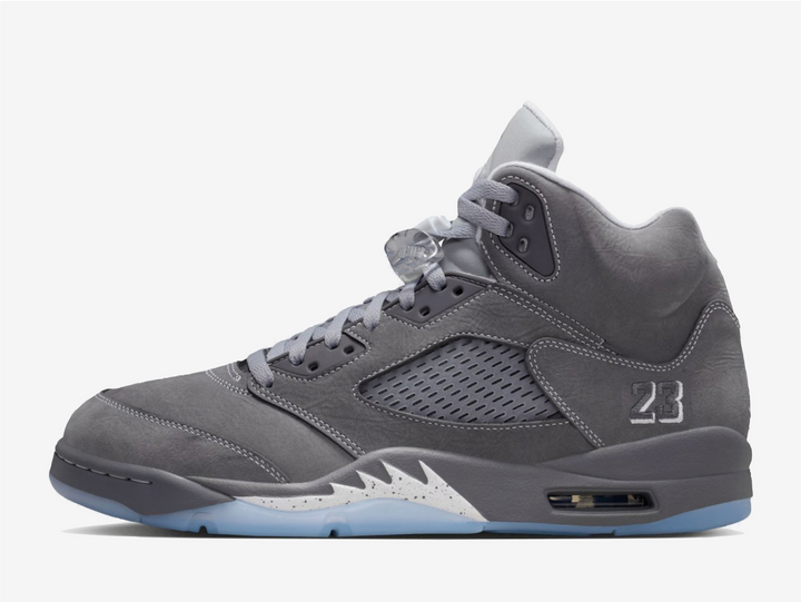 This rendition features a grey nubuck leather upper that feels soft and buttery, while the white contrast stitching highlights the bulky structure. The plastic netting on the quarter covers the mesh side panels for breathability. An embroidered “23” adorns the lateral foxing as a nod to MJ’s jersey number, complementing the trademark Jumpman logo on the rear and puffy tongue. The lace locks and padded collars provide a snug, pillow-like fit around the ankles, ensuring comfort from day to night.
