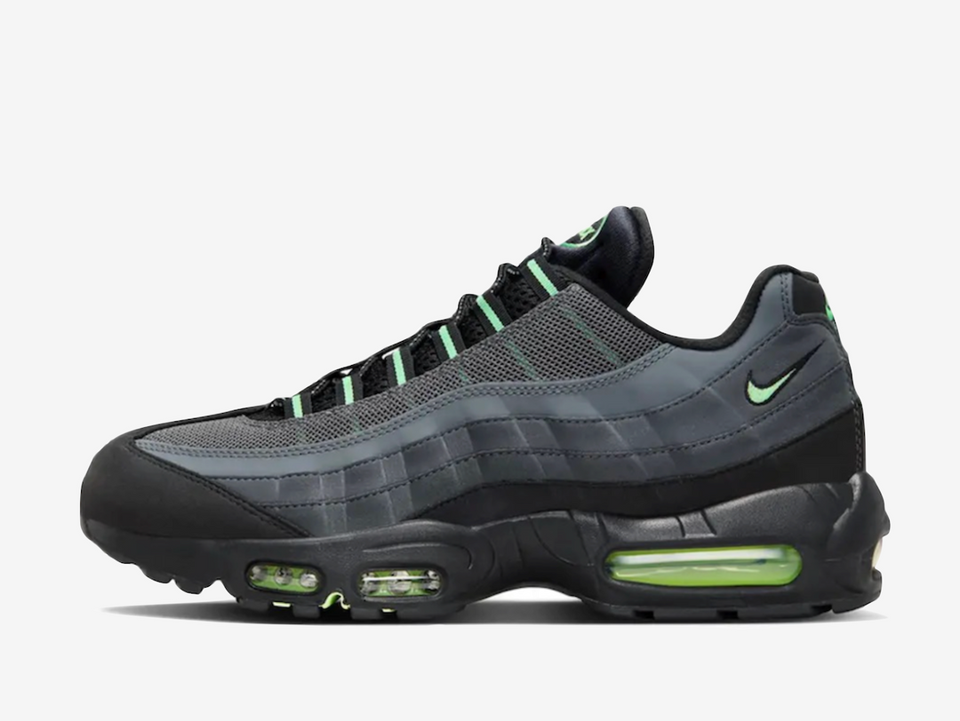 Exclusive Air Max 95 with a black upper and green accents, incorporating nubuck, suede, mesh, and synthetic leather to bolster its structure.