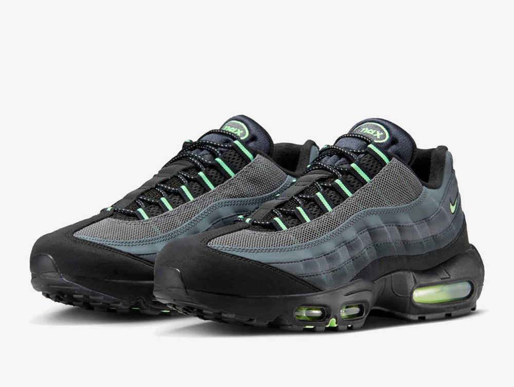 Exclusive Air Max 95 with a black upper and green accents, incorporating nubuck, suede, mesh, and synthetic leather to bolster its structure.