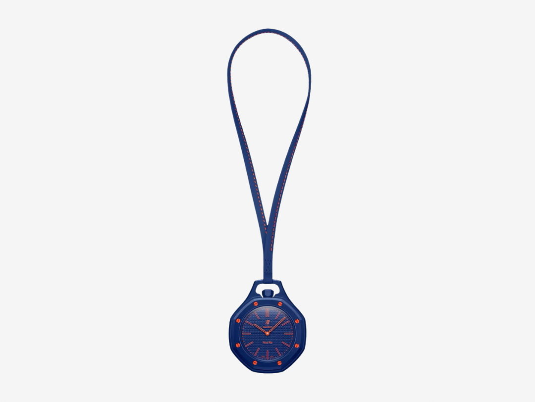 The ORENJI HACHI pocket watch features a navy dial with a tapisserie effect, as well as hour markers and hands coated in Grade A Super-LumiNova® (blue emission). It has a sapphire crystal that offers enhanced scratch resistance and features an anti‑reflective coating. Reminiscent of AP's Royal Oak collection, it has a navy octagonal bezel and crown made from Bioceramic and eight orange hexagonal Bioceramic screws welded to the case.