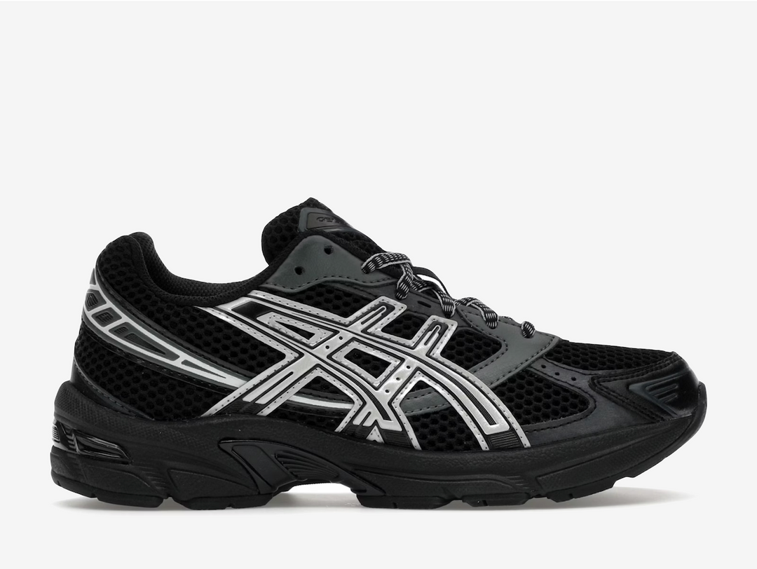 The Black Glacier Grey ASICS Gel-1130 begins with an upper of black mesh. Leather strips course across the upper, in shades of gray, black, and white. These overlays offer an early 2000’s running shoe aesthetic, as well as support, enhanced at both the toe cap and heel. The black foam midsole features GEL technology in the heel for ultimate comfort cushioning. An incorporated TRUSSTIC support system improves stability with every step. 