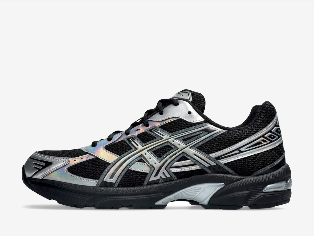 This contemporary twist on the late 2000s running shoe flaunts a blacked-out open mesh underlay with iridescent silver accents on the synthetic overlays, creating a colour-shifting effect that changes from every angle. The ASICS Tiger Stripes reinforce the quarter panels, while assorted brand labels animate the tongue, rear, and sockliner. A blacked-out EVA foam midsole encases a visible GEL insert in the heel for long-lasting comfort and maximum energy return.