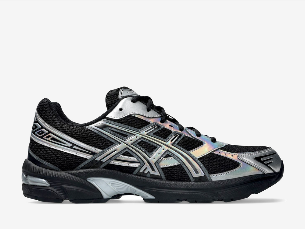 This contemporary twist on the late 2000s running shoe flaunts a blacked-out open mesh underlay with iridescent silver accents on the synthetic overlays, creating a colour-shifting effect that changes from every angle. The ASICS Tiger Stripes reinforce the quarter panels, while assorted brand labels animate the tongue, rear, and sockliner. A blacked-out EVA foam midsole encases a visible GEL insert in the heel for long-lasting comfort and maximum energy return.