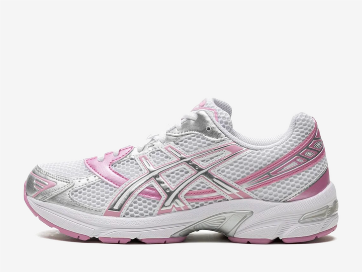Rooted in running heritage with a modern street edge, the ASICS Gel-1130 “White Pure Silver Pink” delivers retro sport energy for everyday wear. Signature GEL™ cushioning meets a fresh yet familiar colourway, combining clean white panelling with soft pink accents and pure silver detailing. Built for movement and designed for sneaker culture, it transitions effortlessly from pavement to lifestyle, offering comfort without compromising on character.