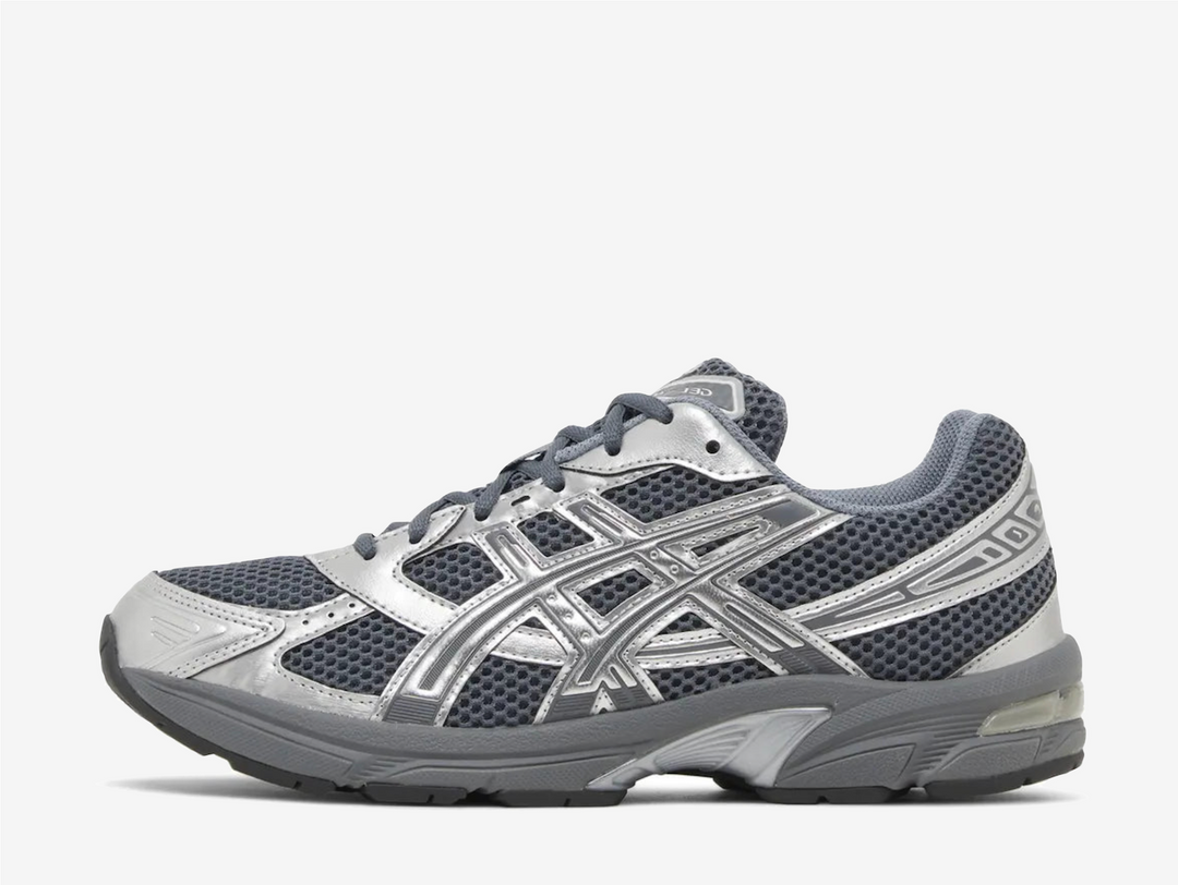 The ASICS Gel-1130 Steel Grey Pure Silver is a sleek and stylish sneaker that combines comfort and performance. Featuring a steel grey upper accented with pure silver details, this shoe offers a modern and versatile look perfect for any occasion. The Gel-1130 incorporates ASICS' renowned GEL technology in the heel, providing excellent shock absorption and optimal cushioning for all-day comfort.