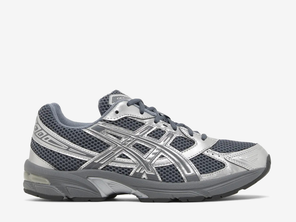 The ASICS Gel-1130 Steel Grey Pure Silver is a sleek and stylish sneaker that combines comfort and performance. Featuring a steel grey upper accented with pure silver details, this shoe offers a modern and versatile look perfect for any occasion. The Gel-1130 incorporates ASICS' renowned GEL technology in the heel, providing excellent shock absorption and optimal cushioning for all-day comfort.