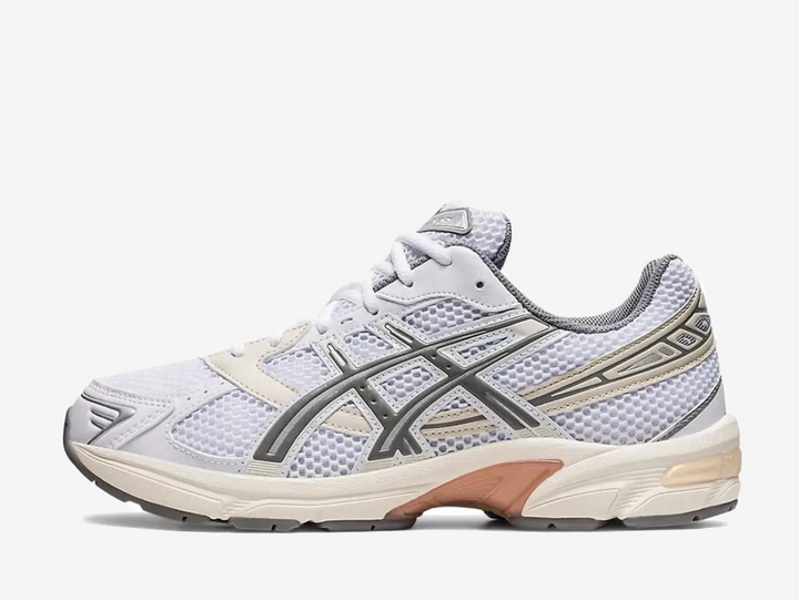 Exclusive Asics Gel 1130 sneakers with a pristine white, wide-holed mesh base and synthetic overlays.