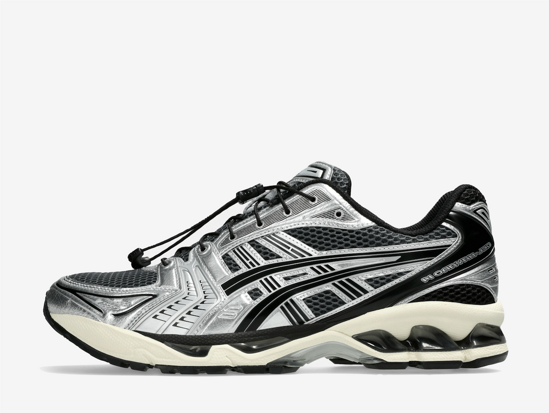 This iteration features a dark grey open mesh underlay with glossy metallic silver accents on the synthetic reinforcements. Pitch-black Tiger Stripes cover the sidewalls, whilst trademark branding adorns the tongue, rear, and sockliner. The speed-lacing system offers a secure, supportive fit, embracing the silhouette’s technical design. Visible GEL inserts nestle within the plush foam midsole for responsive cushioning and long-lasting comfort.