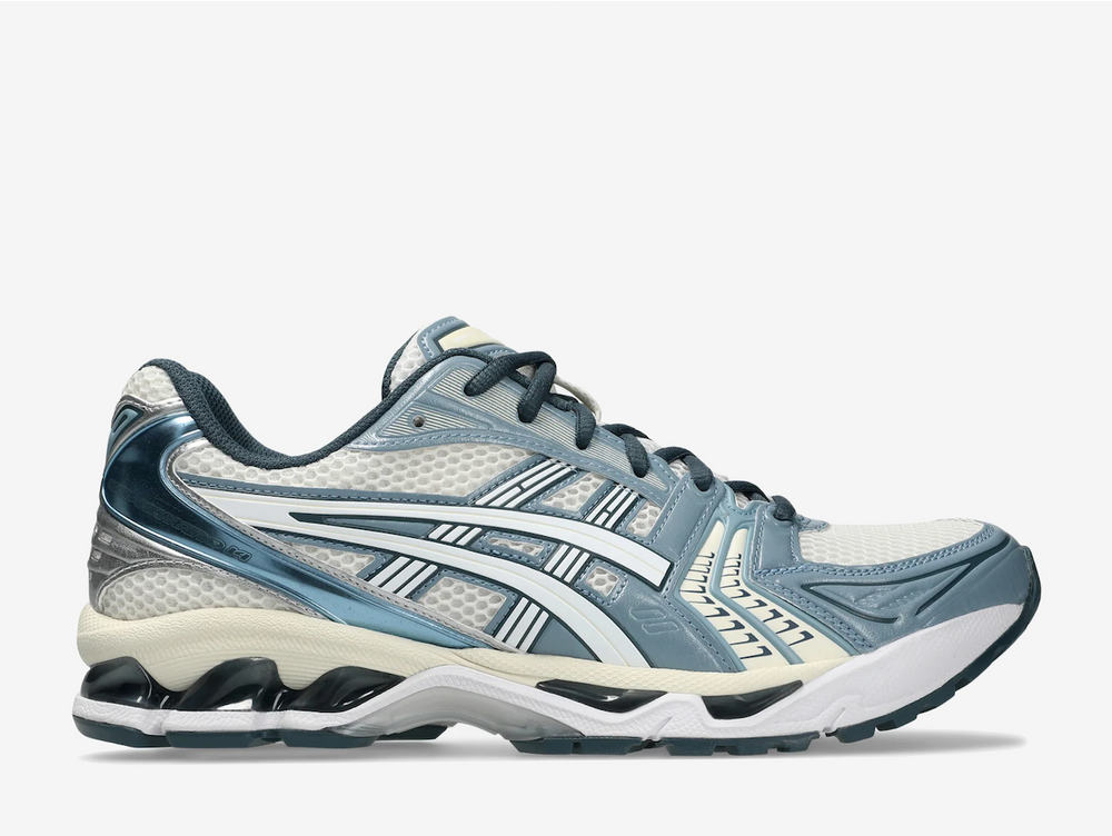 Rooted in retro performance, the ASICS GEL-Kayano 14 "Raw Indigo" offers a subtle shift from the familiar, where off-white foundations meet the unexpected pull of pale blue overlays. A mesh base keeps things breathable and true to the throwback blueprint, while the rare indigo accents introduce quiet intrigue across the upper. Blacked-out GEL cushioning underfoot adds an uncommon edge, balancing the nostalgic neutral palette with modern contrast.