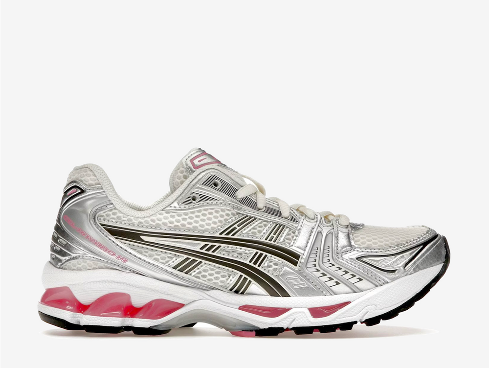 This late 2000s running shoe offers the perfect blend of style and comfort, characterised by its streamlined shape and lightweight construction. This clean Gel-Kayano 14 sports a cream white mesh upper with metallic silver synthetic overlays and blacked-out ASICS Stripes. Vibrant pink accents on the brand labels and GEL pods deliver a delightful vibe, giving the fan-favourite silhouette a pop of colour to brighten your outfit. The TRUSSTIC shank plate and durable rubber sole provide support and traction.