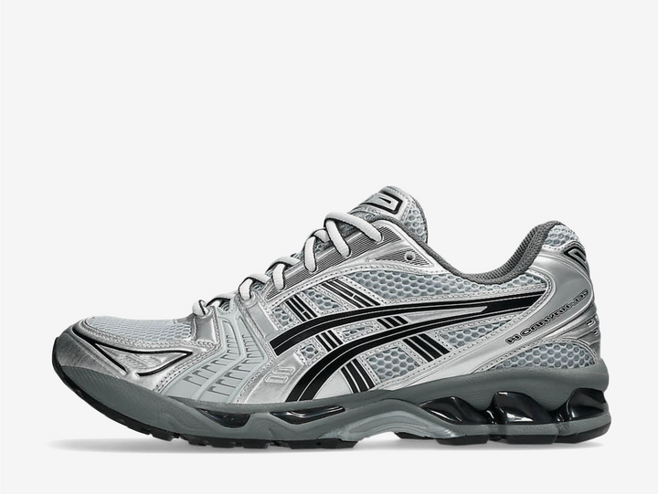 The ASICS Gel-Kayano 14 “Urban Research” reimagines the iconic 2000s runner with a sleek, modern edge. Built in collaboration with Japanese label Urban Research, it features a metallic Pure Silver mesh and synthetic upper with subtle black and grey accents. Performance details like GEL™ cushioning and the TRUSSTIC™ support system ensure all-day comfort, while the dark grey midsole grounds the futuristic look. A perfect balance of heritage running design and contemporary street style.