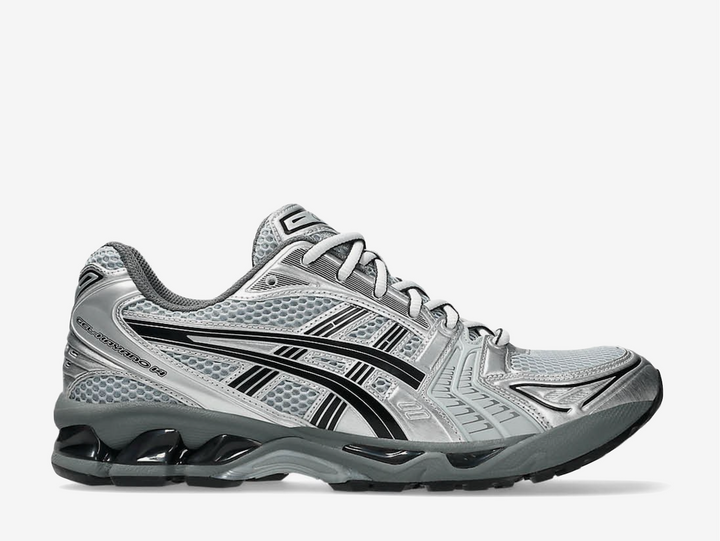 The ASICS Gel-Kayano 14 “Urban Research” reimagines the iconic 2000s runner with a sleek, modern edge. Built in collaboration with Japanese label Urban Research, it features a metallic Pure Silver mesh and synthetic upper with subtle black and grey accents. Performance details like GEL™ cushioning and the TRUSSTIC™ support system ensure all-day comfort, while the dark grey midsole grounds the futuristic look. A perfect balance of heritage running design and contemporary street style.