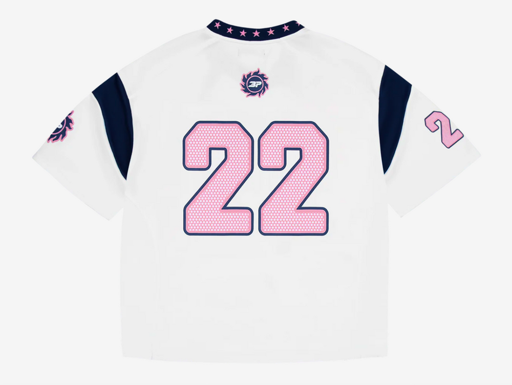This jersey is made from recycled polyester fabric, combining sustainability with performance. It features a mix of puff and screen prints across the chest, sleeves, and back for a dynamic, layered look. A woven star neck rib adds a unique design detail, while an embroidered patch on the neck enhances the premium finish. The jersey fits true to size, offering comfort without compromising style.