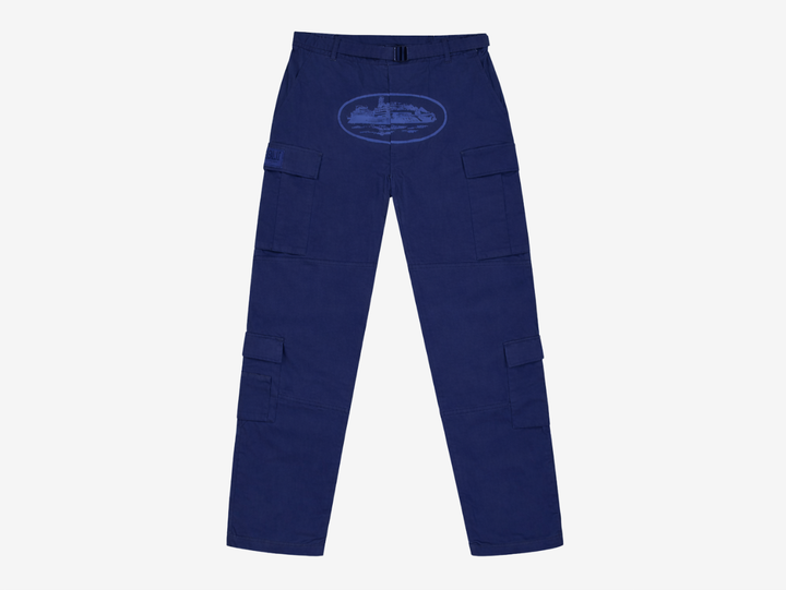The Corteiz Alcatraz Guerillaz Cargo Trousers deliver a perfect blend of utility and streetwear style. Made from durable heavyweight fabric, they feature multiple functional cargo pockets, an adjustable waist belt, and bold branded detailing, including the signature Alcatraz graphic. Presented in a deep navy base with tonal navy accents, these trousers offer everyday comfort, practical design, and unmistakable Corteiz identity.
