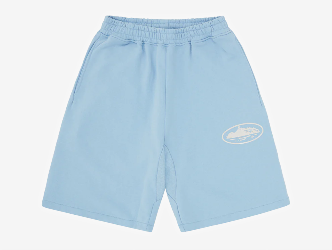 The Corteiz Island Puff Print Sweatshort in Baby Blue combines Corteiz’s signature streetwear aesthetic with a soft pastel colourway and raised puff print branding. Made from heavyweight cotton-rich fleece with a brushed interior, the shorts provide a comfortable yet structured fit suitable for everyday wear. Designed with an elasticated waistband, adjustable drawcord, and functional side pockets. Constructed from a premium cotton and polyester blend with an approximate 440 GSM heavyweight fabric weight.