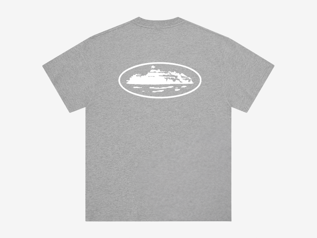 The Corteiz Island T-Shirt in Heather Grey combines everyday comfort with bold graphic design. Made from 100% cotton, it features a screen-printed Island graphic on both the front and back, delivering the brand’s signature statement look. Finished on a Corteiz cut-and-sewn blank for a premium feel and true-to-size fit, it’s a versatile essential for any rotation.