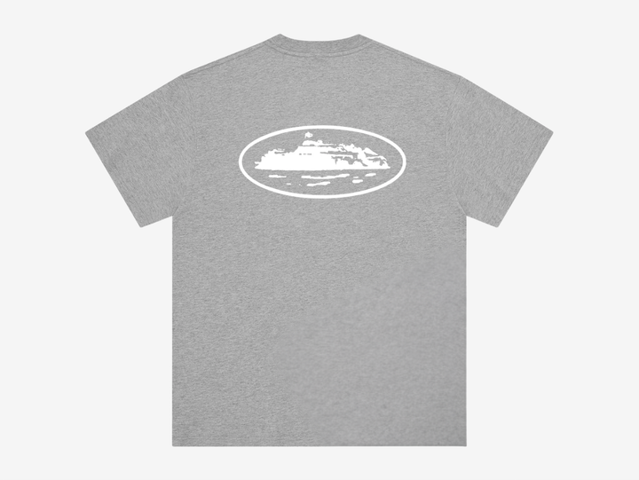 The Corteiz Island T-Shirt in Heather Grey combines everyday comfort with bold graphic design. Made from 100% cotton, it features a screen-printed Island graphic on both the front and back, delivering the brand’s signature statement look. Finished on a Corteiz cut-and-sewn blank for a premium feel and true-to-size fit, it’s a versatile essential for any rotation.