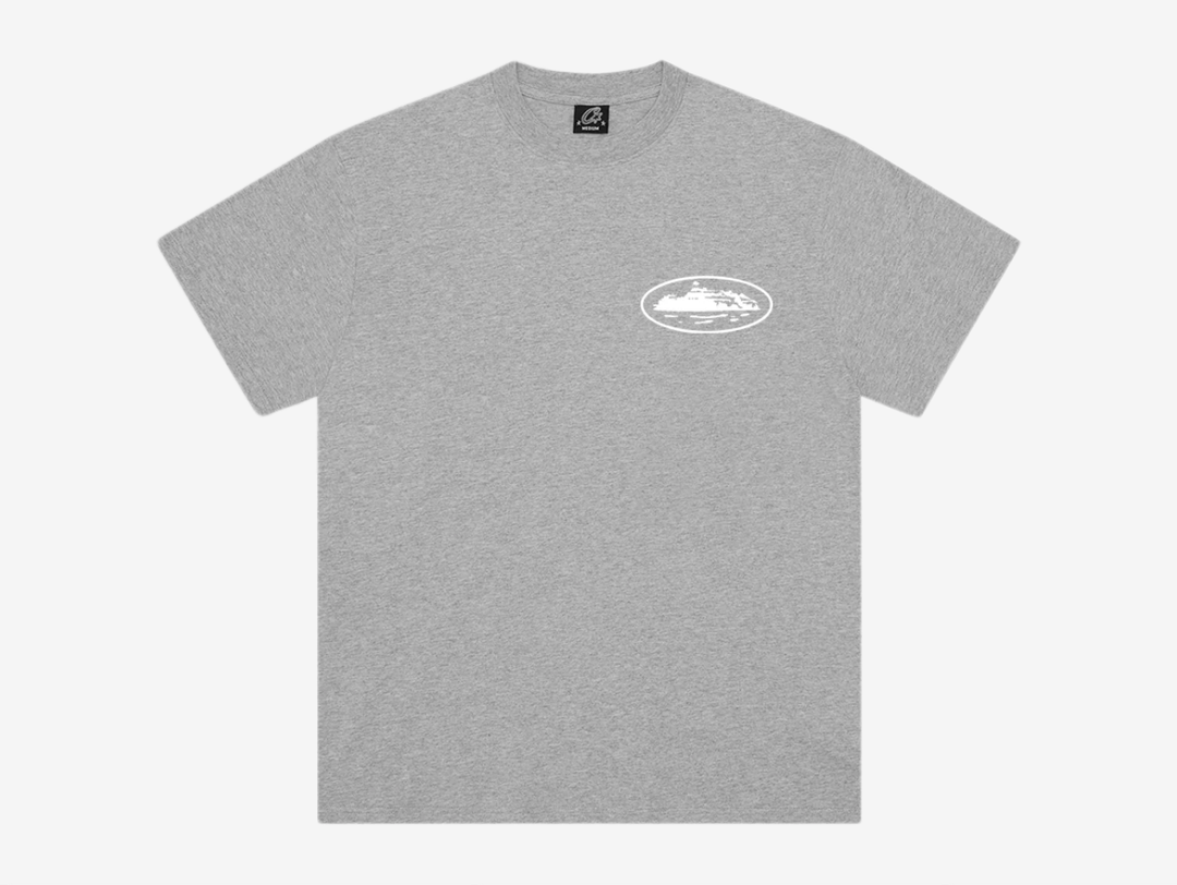 The Corteiz Island T-Shirt in Heather Grey combines everyday comfort with bold graphic design. Made from 100% cotton, it features a screen-printed Island graphic on both the front and back, delivering the brand’s signature statement look. Finished on a Corteiz cut-and-sewn blank for a premium feel and true-to-size fit, it’s a versatile essential for any rotation.