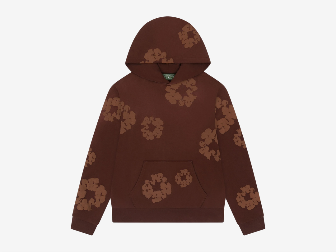 The Denim Tears Cotton Wreath Hoodie in Monochrome Brown blends cultural storytelling with elevated streetwear. Made from heavyweight cotton fleece, it offers a soft yet structured feel for everyday wear. The tonal Cotton Wreath graphic delivers a refined statement, finished with a relaxed fit, ribbed trims, and a classic kangaroo pocket for timeless comfort and style.