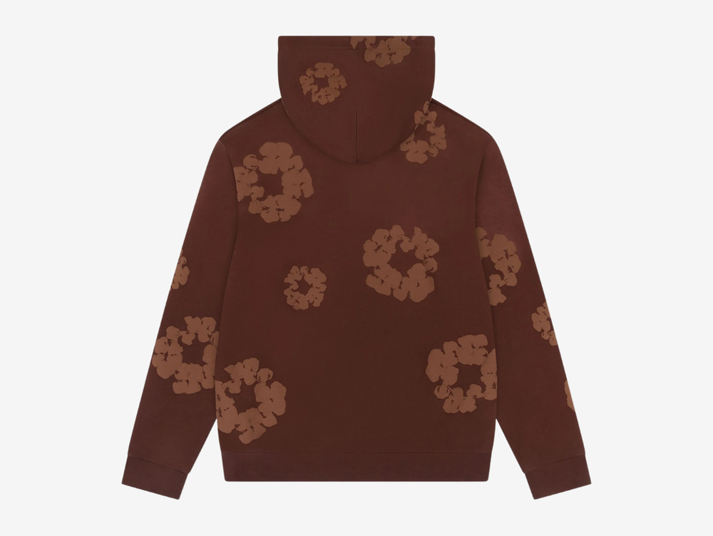 The Denim Tears Cotton Wreath Hoodie in Monochrome Brown blends cultural storytelling with elevated streetwear. Made from heavyweight cotton fleece, it offers a soft yet structured feel for everyday wear. The tonal Cotton Wreath graphic delivers a refined statement, finished with a relaxed fit, ribbed trims, and a classic kangaroo pocket for timeless comfort and style.