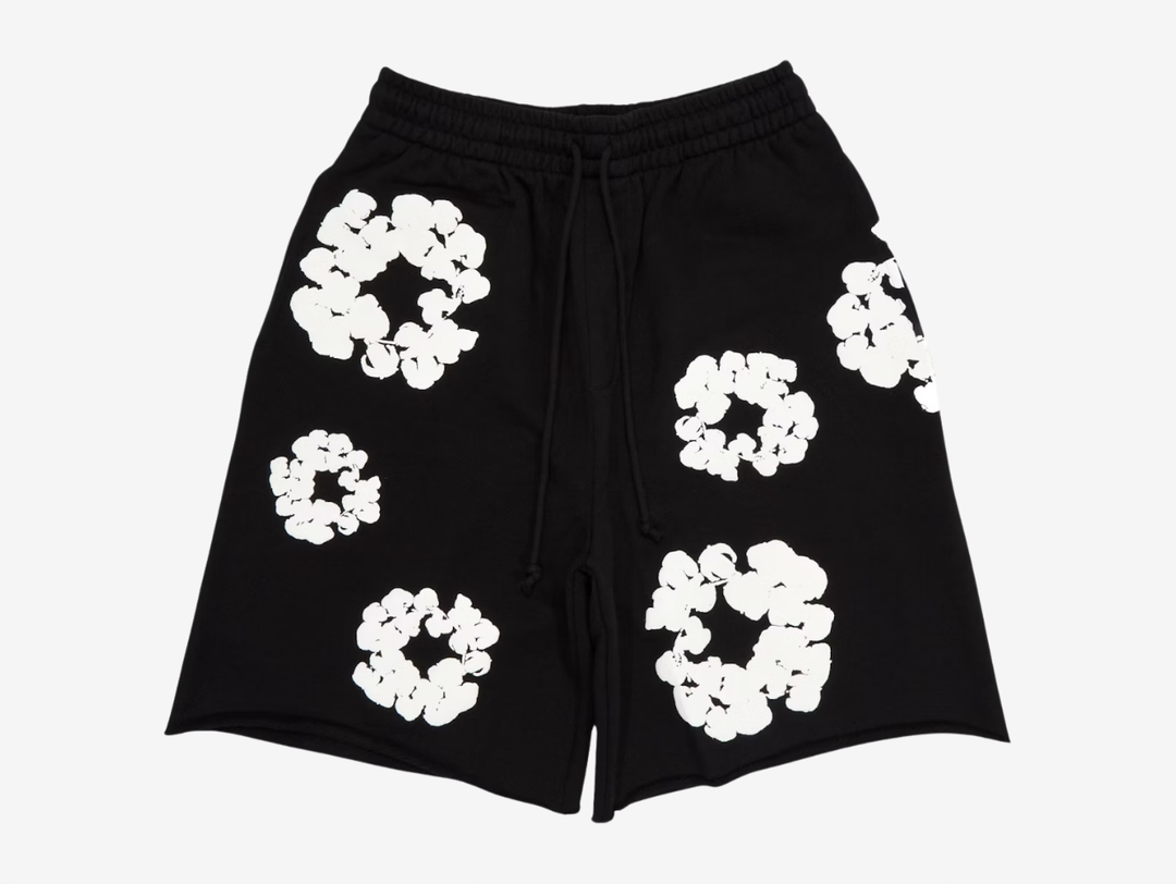 The Black White (FW23) colourway features a black base finished with the iconic cotton wreath graphic printed throughout in contrasting white. The high-contrast design makes the pattern stand out while keeping the overall look clean and wearable. Finished with an elasticated waistband and side pockets, the Denim Tears Cotton Wreath Shorts Black White (FW23) blend statement branding with everyday comfort.