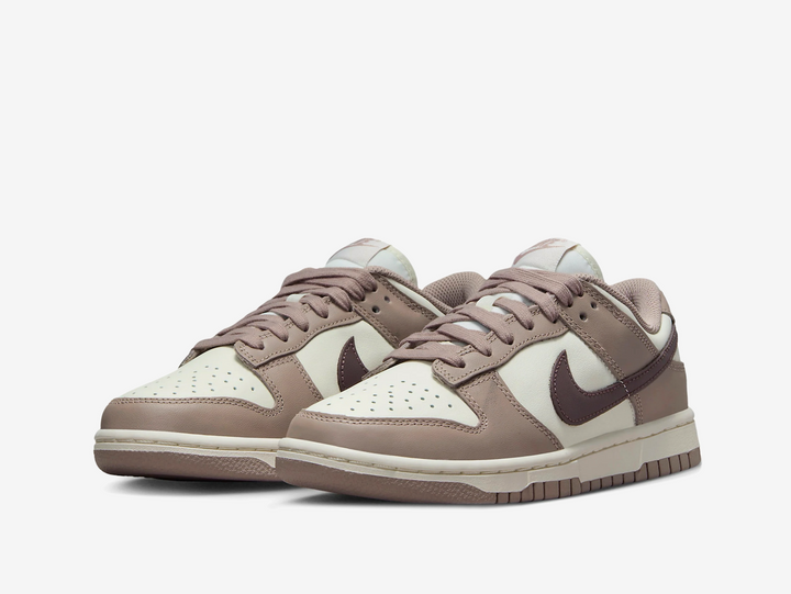 Timeless Nike Dunk sneakers in a beige, brown and white colourway.