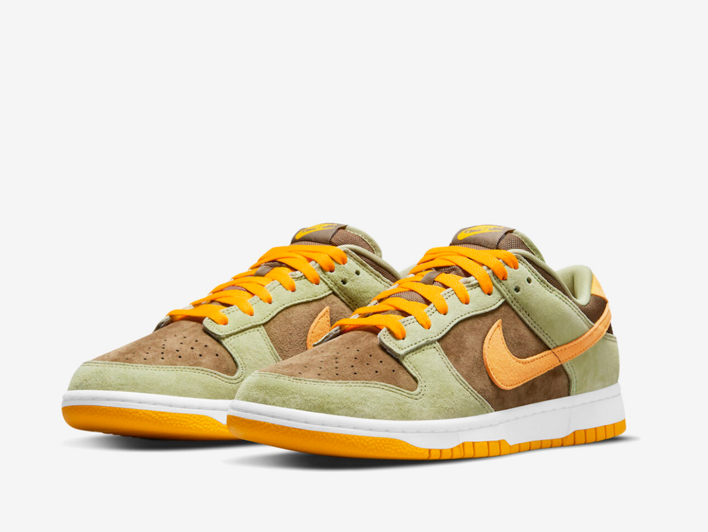 Premium Nike Dunk sneakers with a suede upper in a brown, green and orange colour scheme.