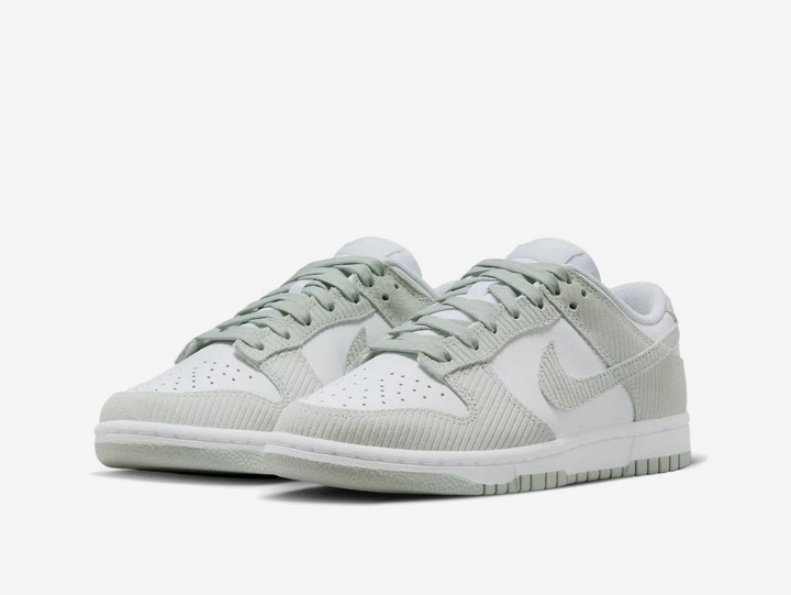 Classic Nike Dunk sneakers in a grey and white colourway.