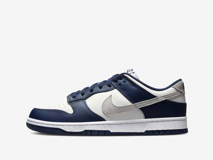 Exclusive Nike Dunk sneakers in a navy blue, silver and white colourway.