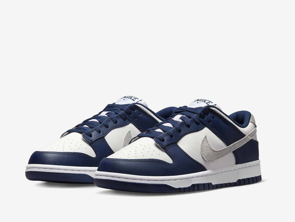 Exclusive Nike Dunk sneakers in a navy blue, silver and white colourway.